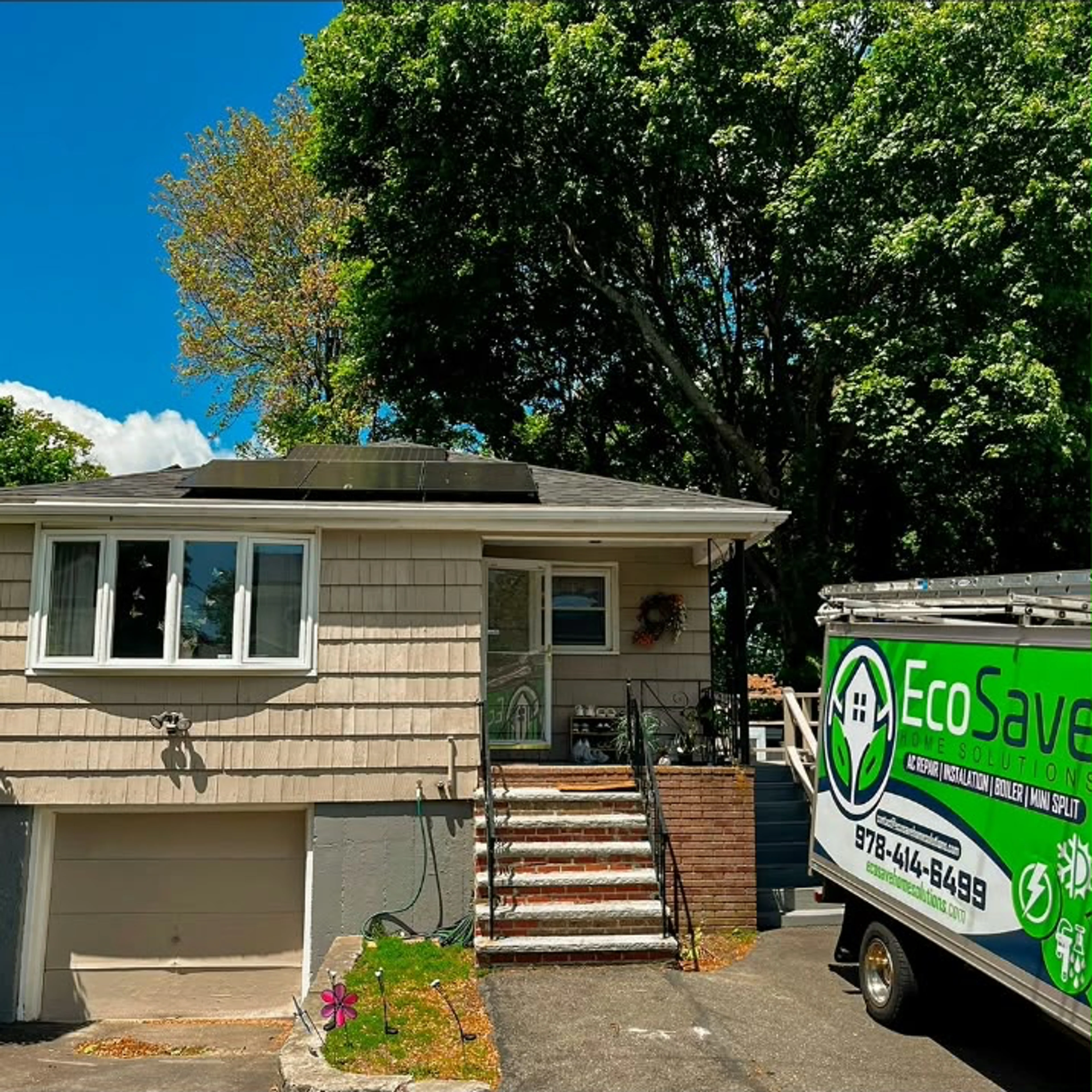 EcoSave service truck beside a Massachusetts home