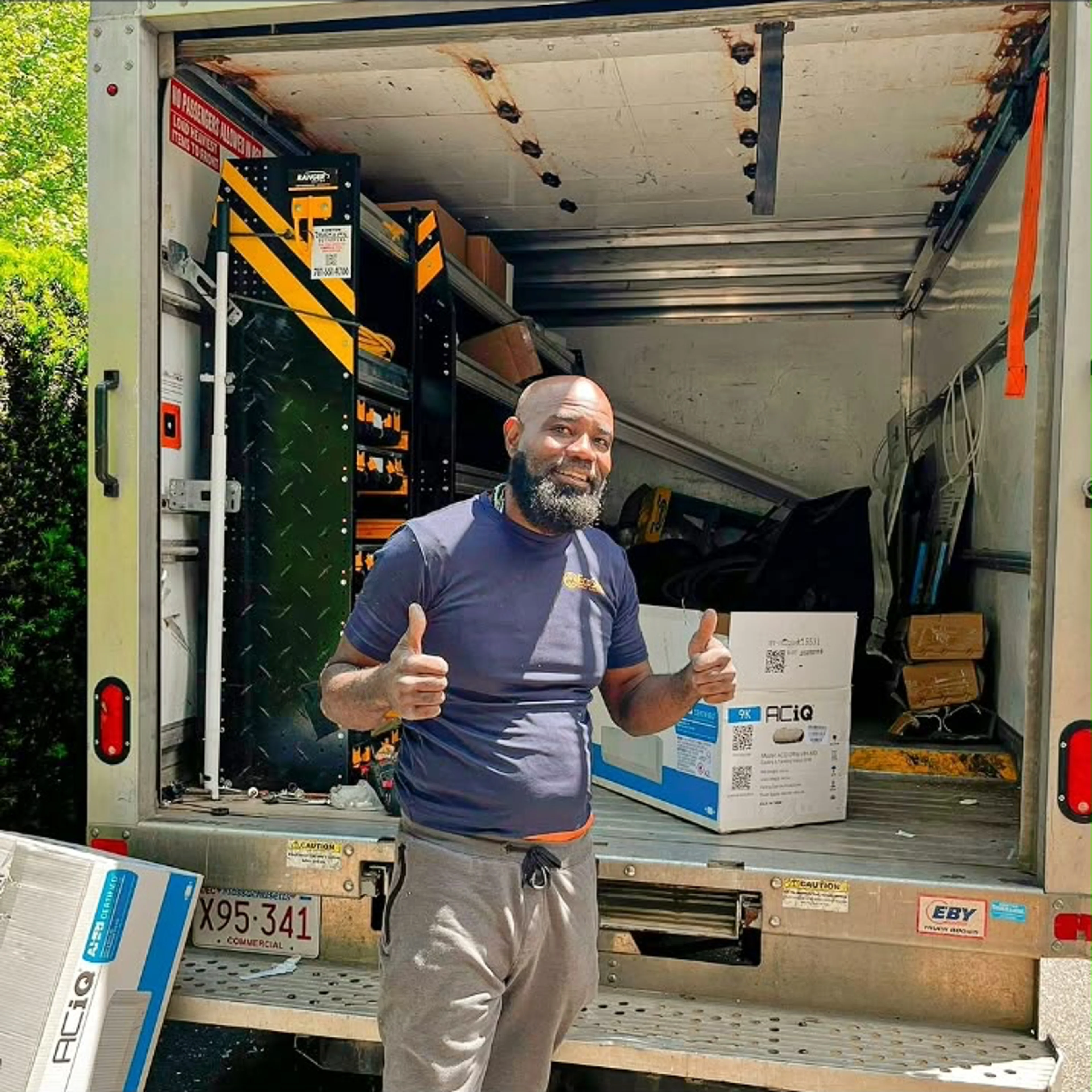 EcoSave team member beside a service truck