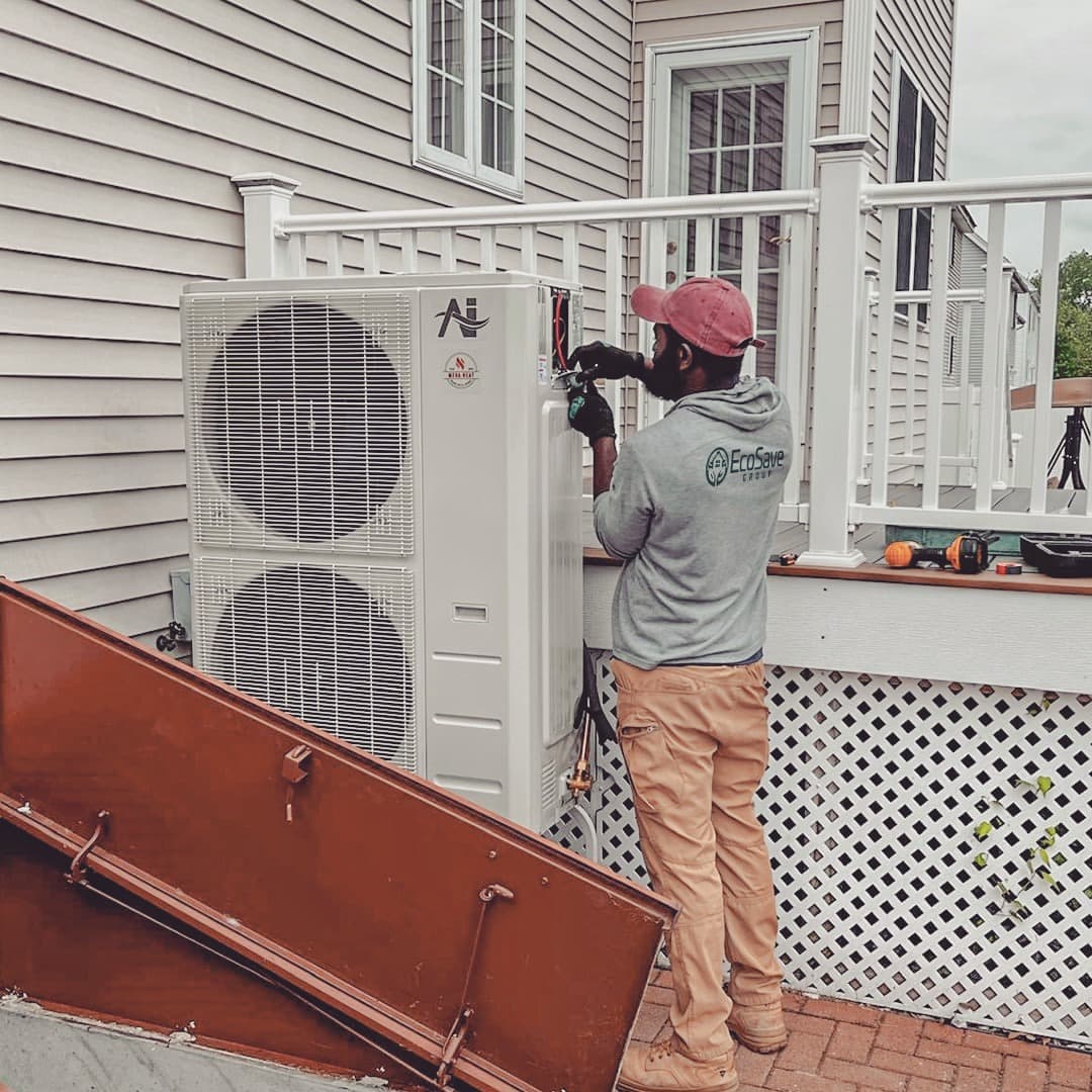 EcoSave technician working on an outdoor heat pump